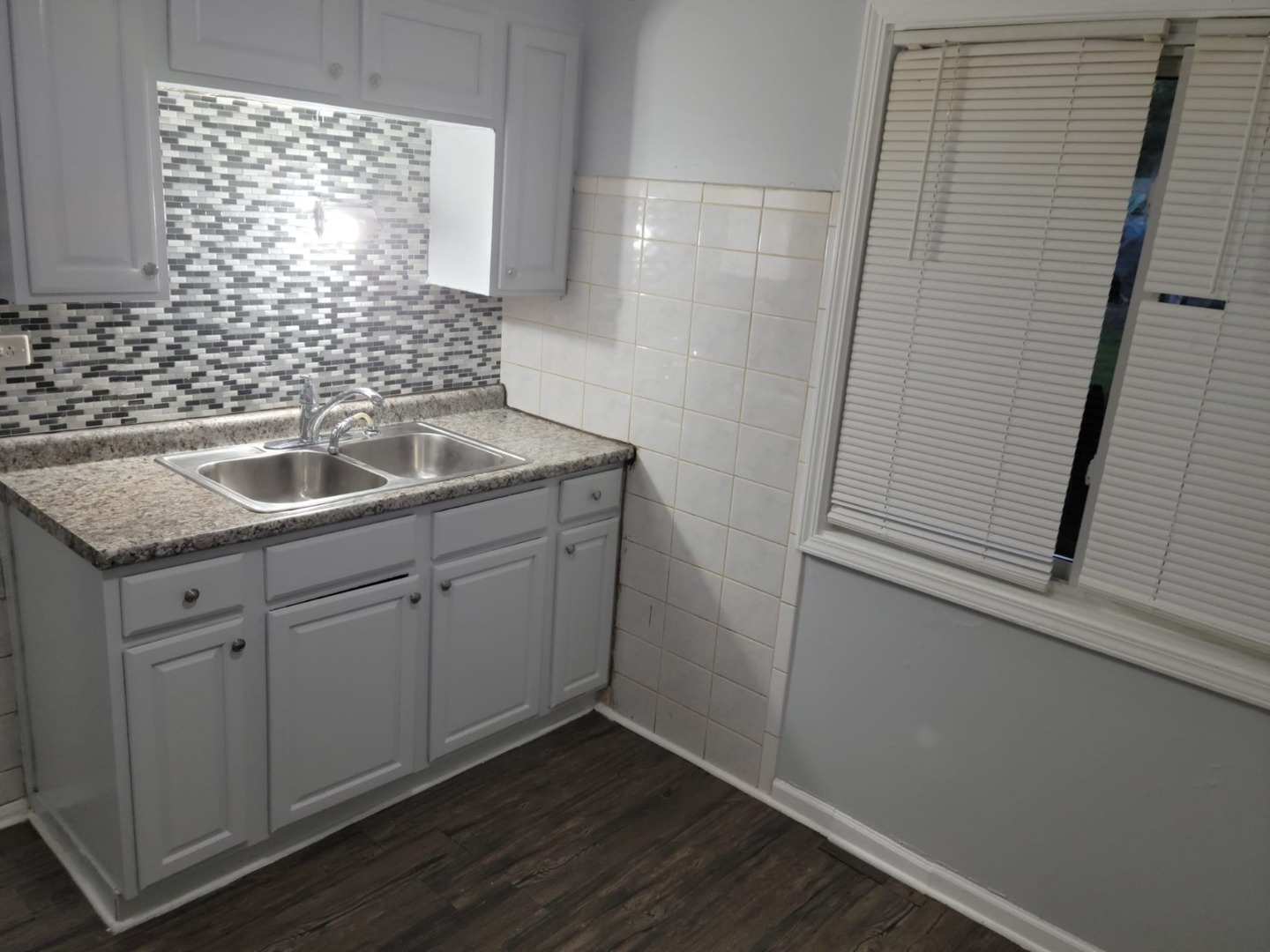 10081 Frontage Road, Unit D Skokie, IL 60077 - Photo 9 of 12 a kitchen with a sink and cabinets