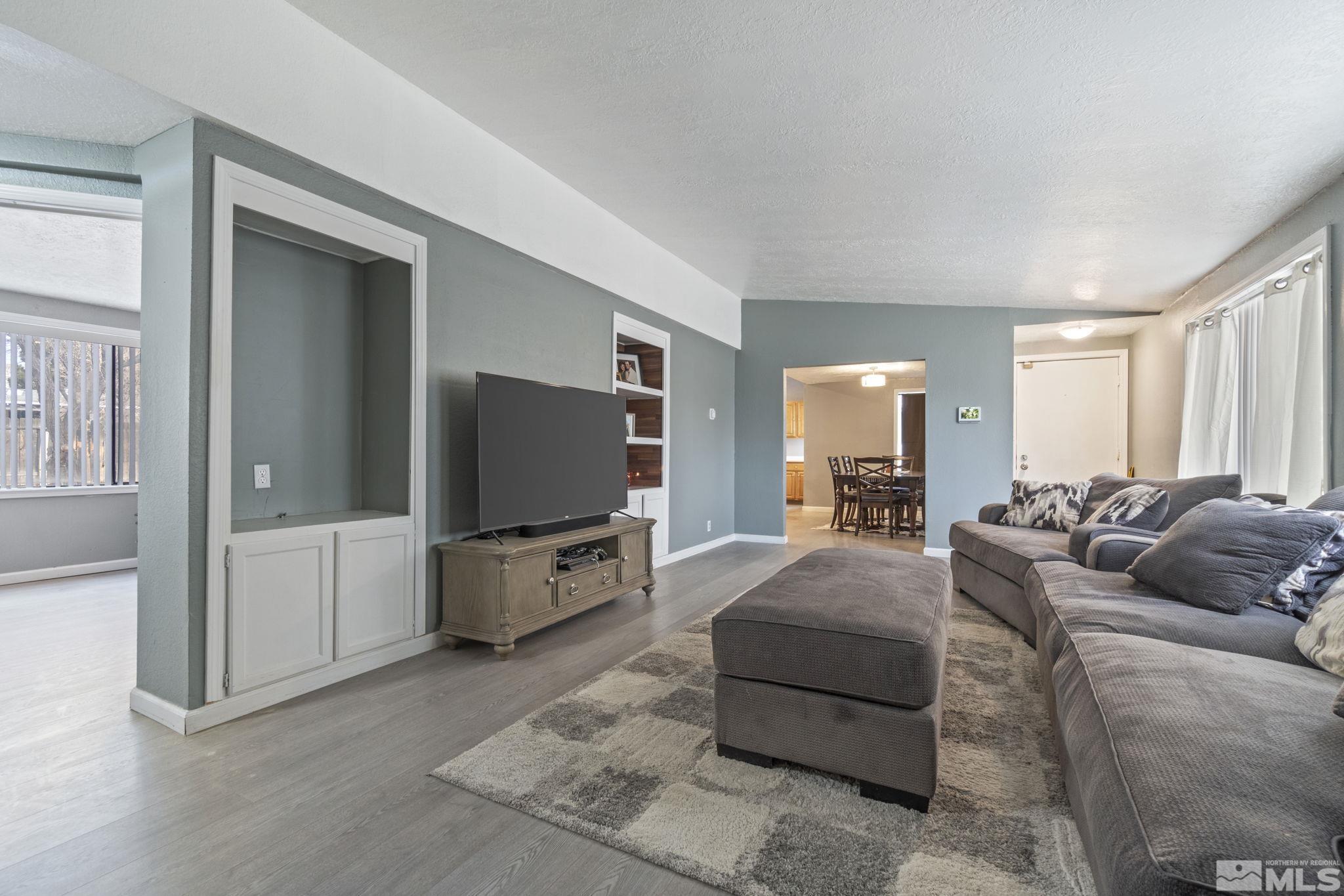 3940 Macaw Lane Reno, NV 89508 - Photo 12 of 35 a living room with furniture and a flat screen tv