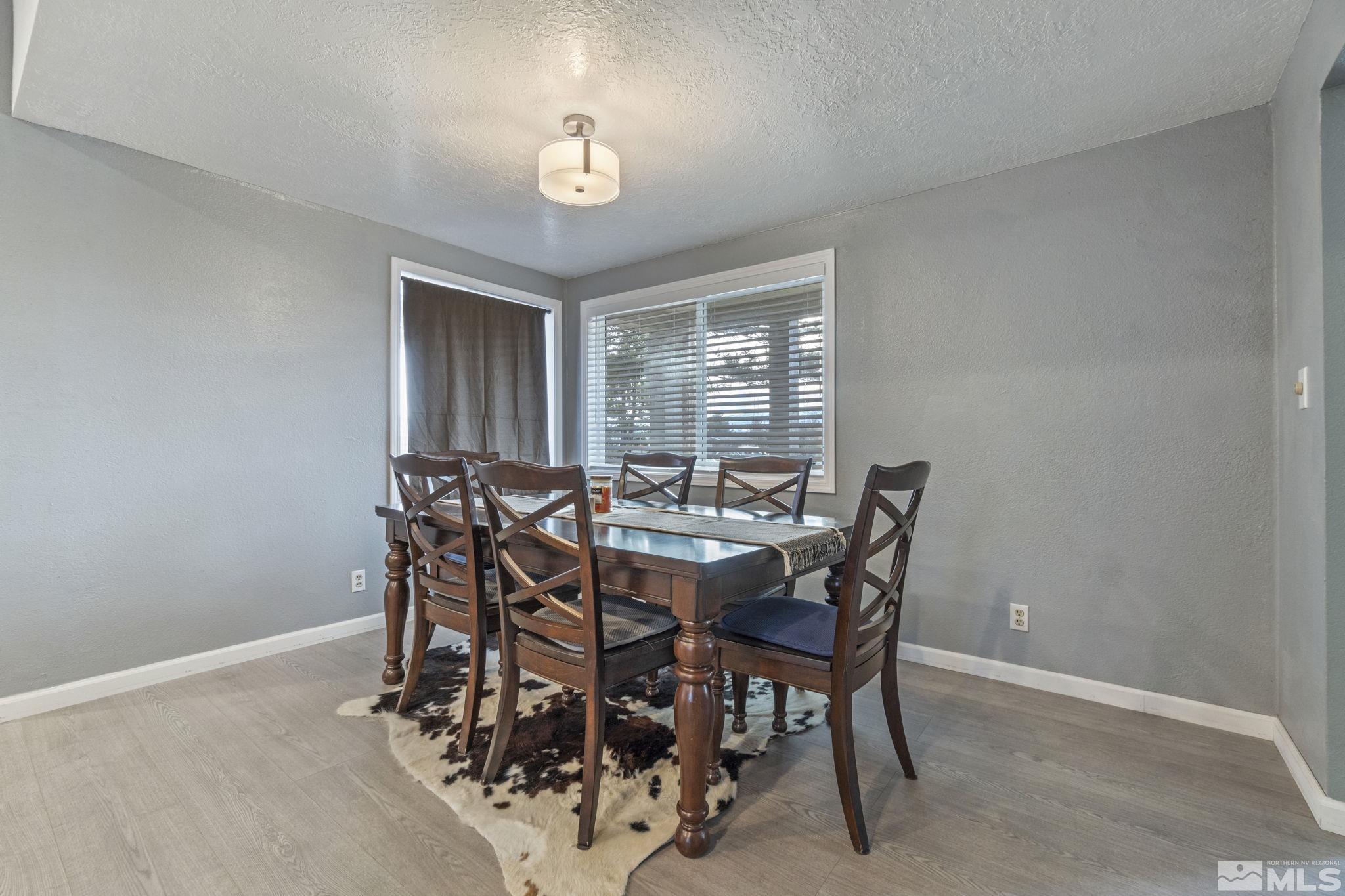 3940 Macaw Lane Reno, NV 89508 - Photo 13 of 35 a view of a dining room with furniture and chandelier