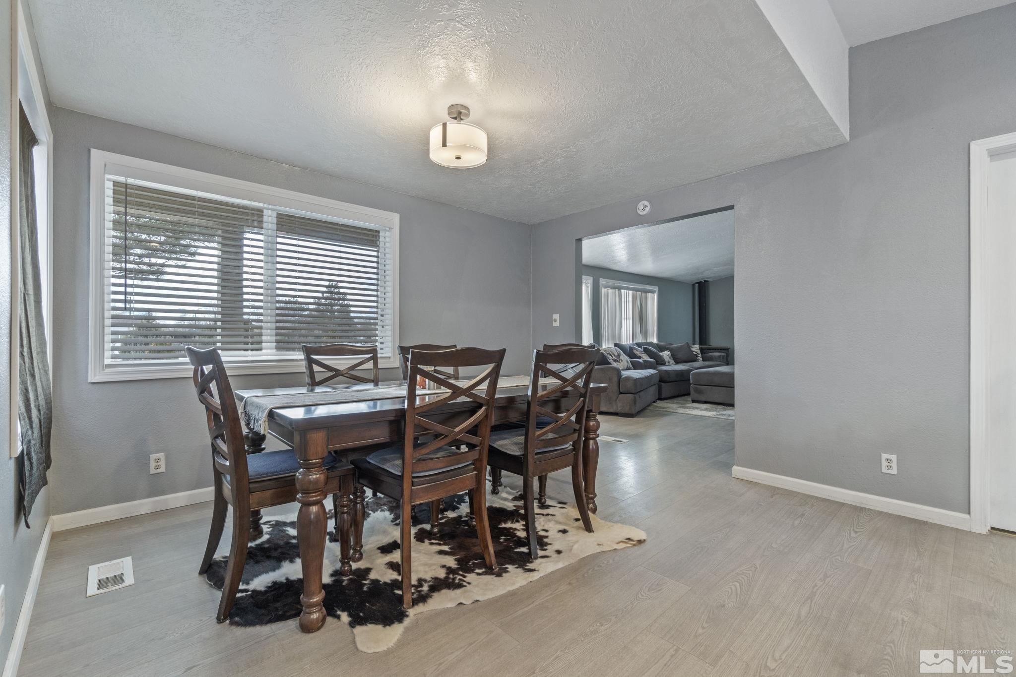 3940 Macaw Lane Reno, NV 89508 - Photo 14 of 35 a view of a dining room with furniture and a window