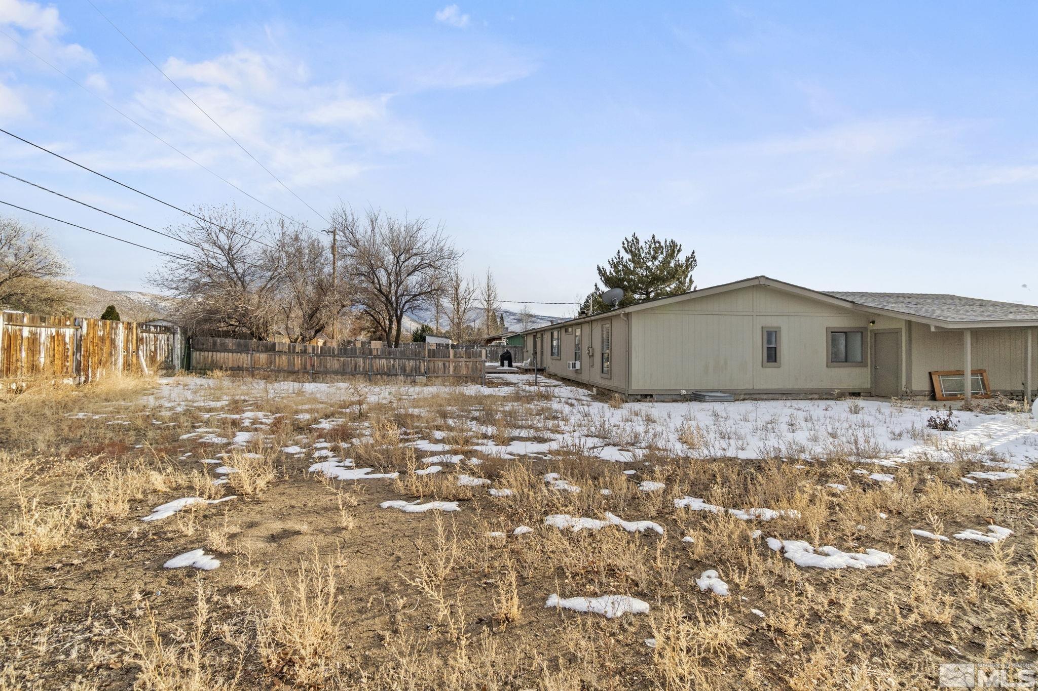 3940 Macaw Lane Reno, NV 89508 - Photo 2 of 35 a front view of a house with a yard