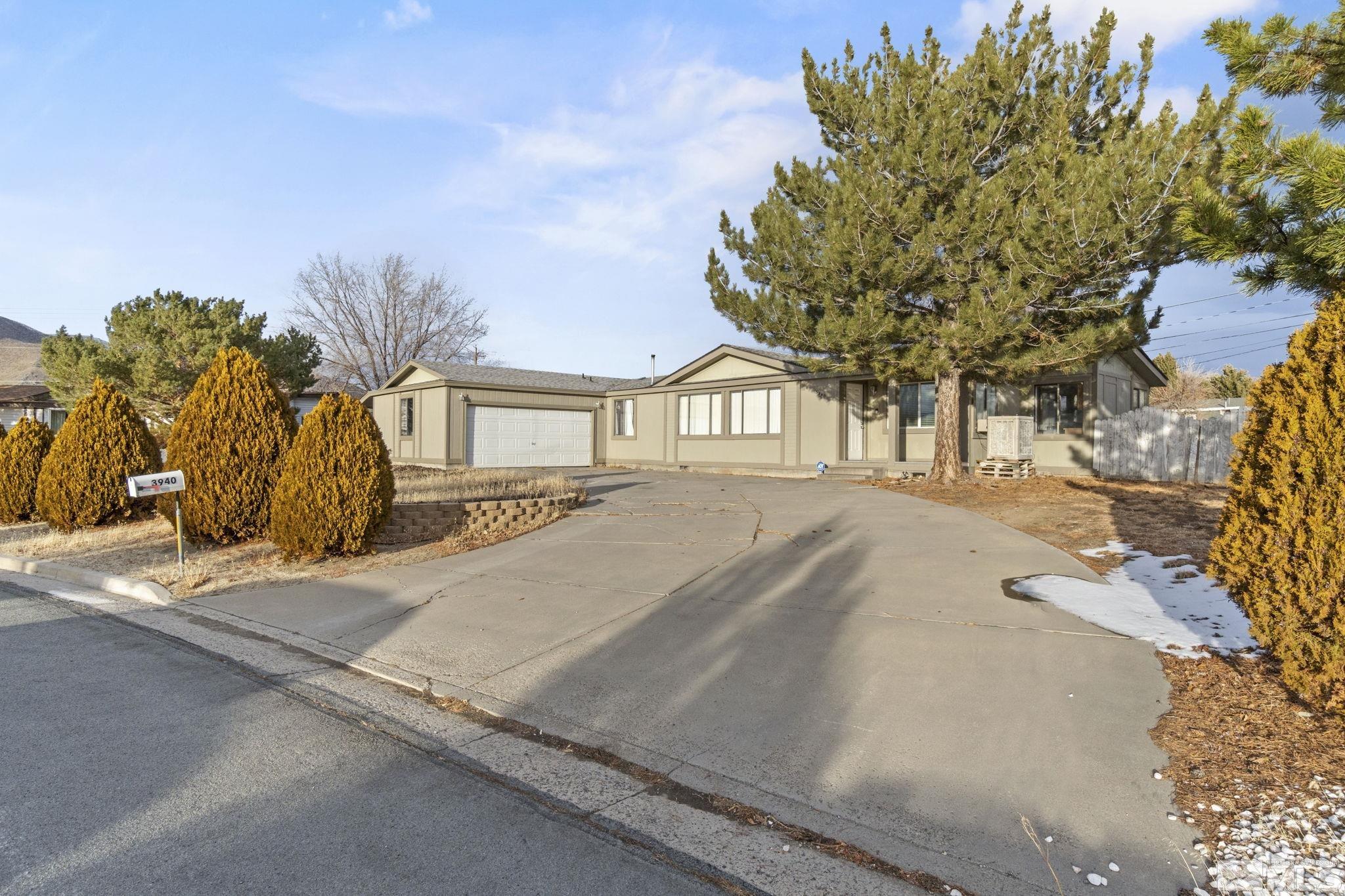 3940 Macaw Lane Reno, NV 89508 - Photo 3 of 35 a house with tree in front of it