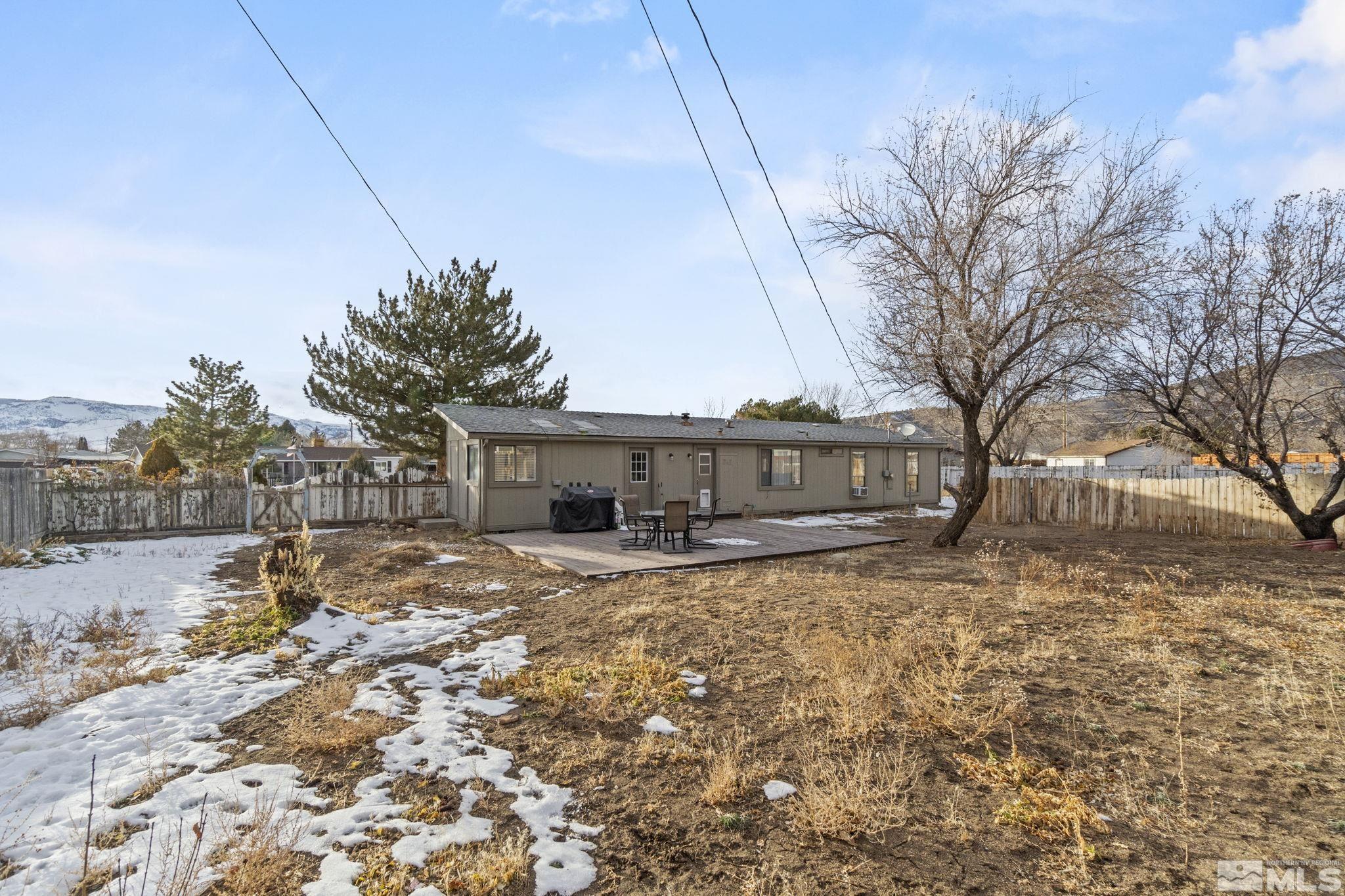3940 Macaw Lane Reno, NV 89508 - Photo 32 of 35 a view of a house with a yard covered in snow