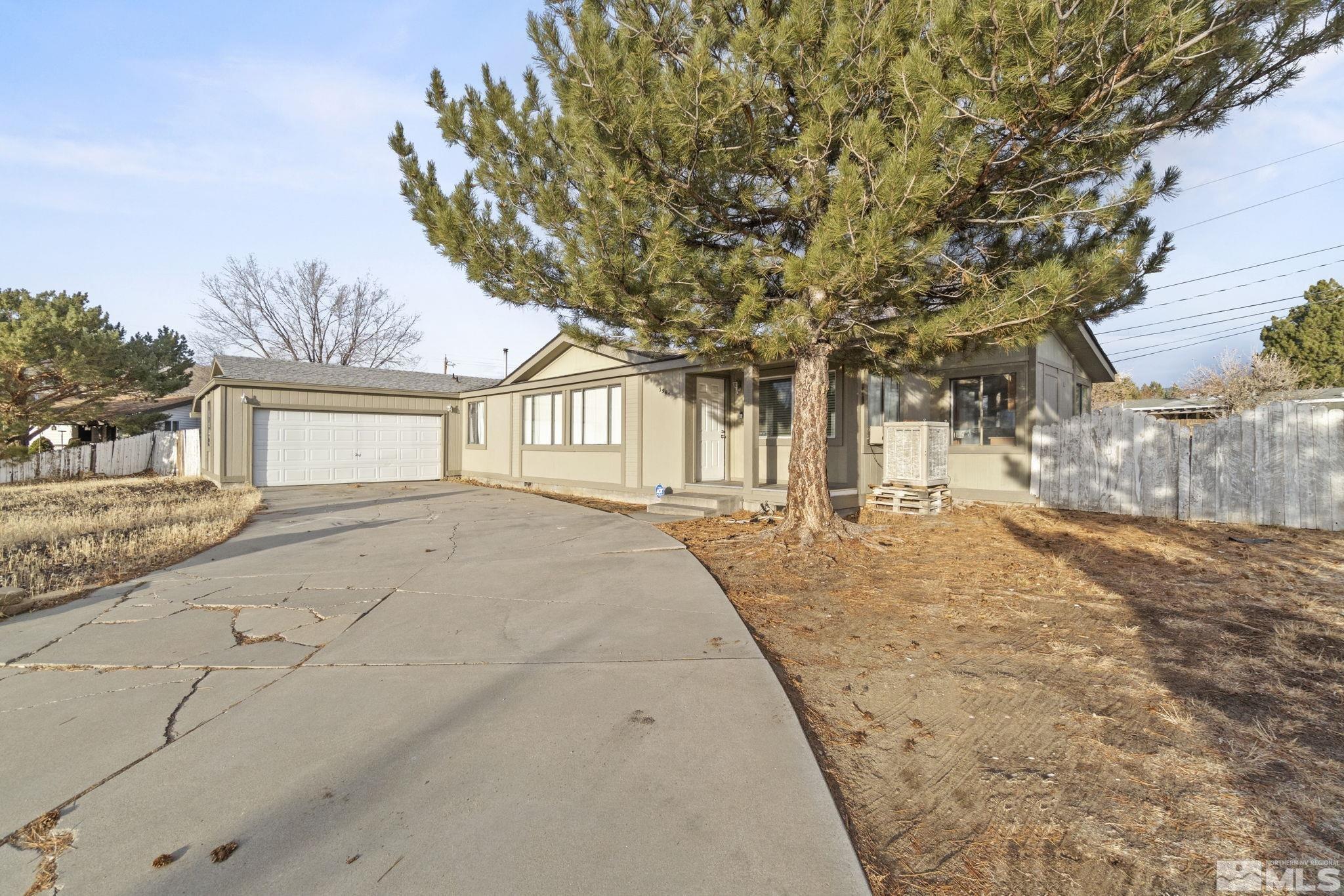 3940 Macaw Lane Reno, NV 89508 - Photo 5 of 35 a house with trees in front of it