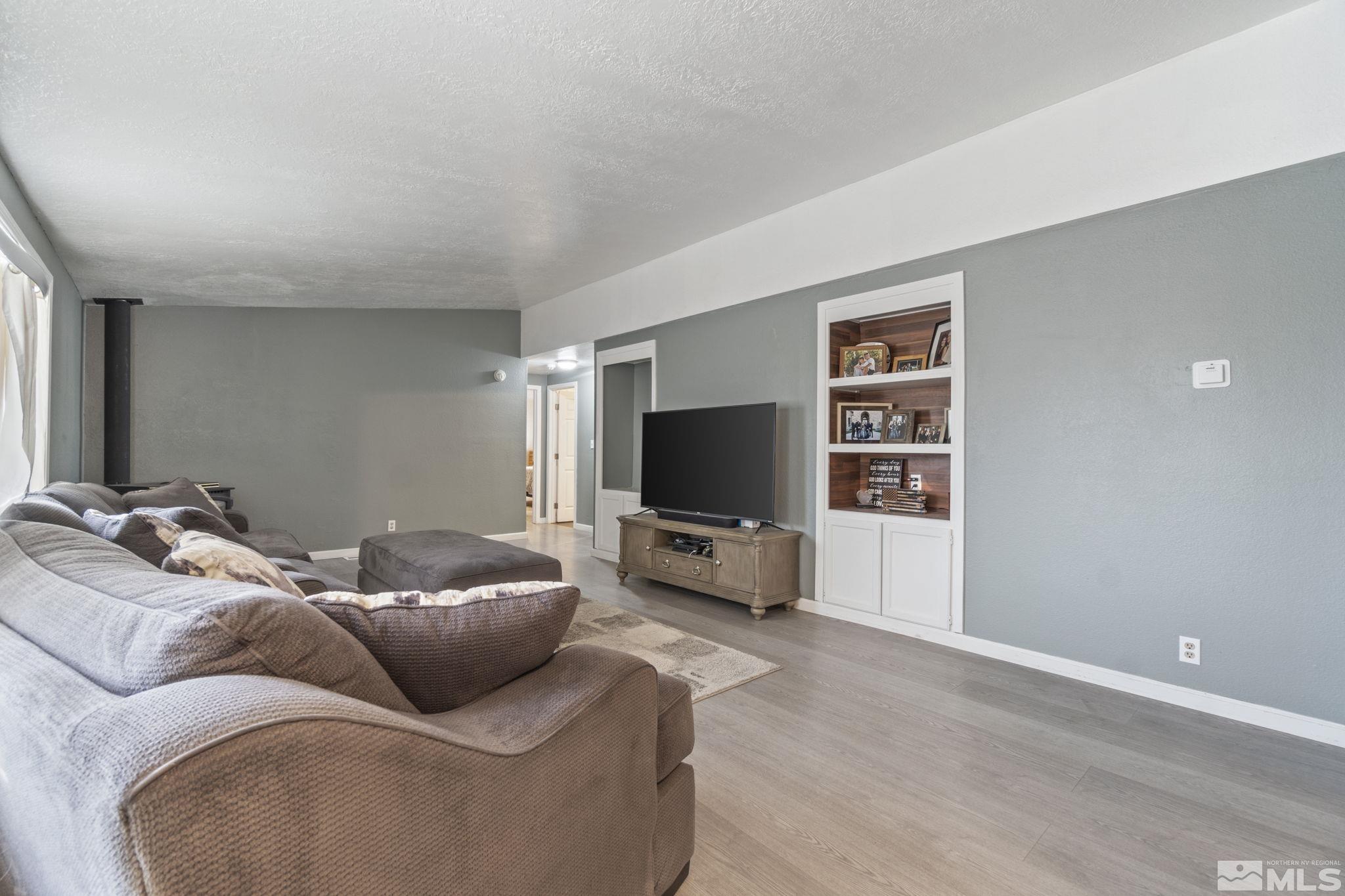 3940 Macaw Lane Reno, NV 89508 - Photo 8 of 35 a living room with furniture and a flat screen tv