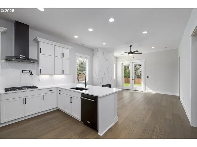a kitchen with a sink stove and cabinets