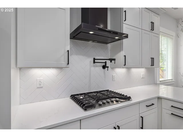 a kitchen with a stove and a cabinet