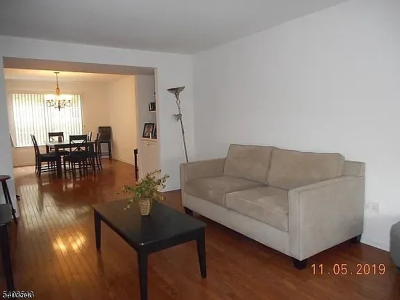 1 Leigh Road Hillsborough, NJ 08844 - Photo 3 of 3 a living room with furniture and a large window