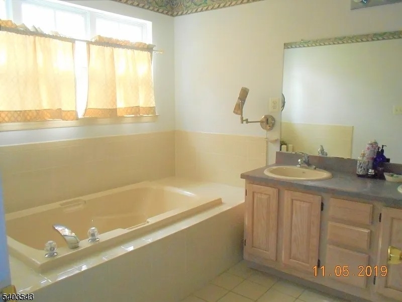 1 Leigh Road Hillsborough, NJ 08844 - Photo 5 of 7 a bathroom with a sink and a bathtub