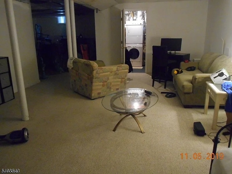 1 Leigh Road Hillsborough, NJ 08844 - Photo 6 of 7 a living room with furniture and a mirror