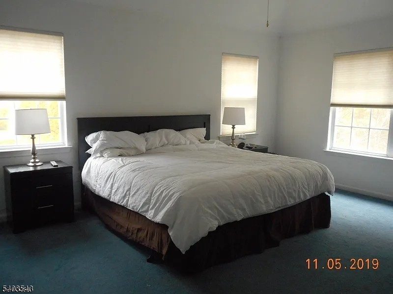 1 Leigh Road Hillsborough, NJ 08844 - Photo 7 of 7 a bedroom with a bed and window