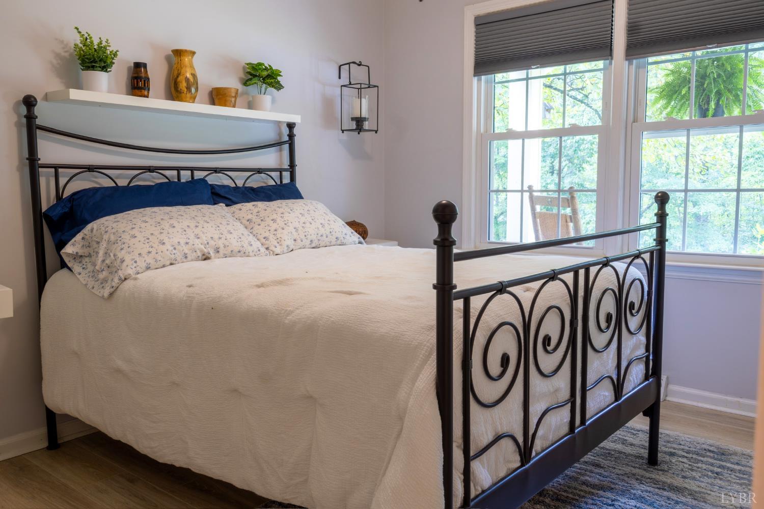 14611 Leesville Road Evington, VA 24550 - Photo 13 of 30 a bedroom with a bed and window