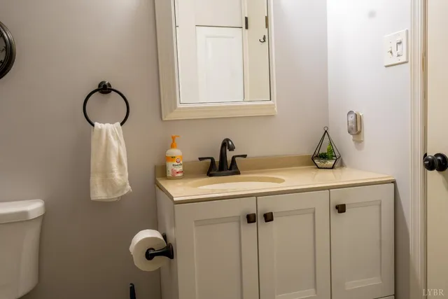 a bedroom with a bunk bed and a window