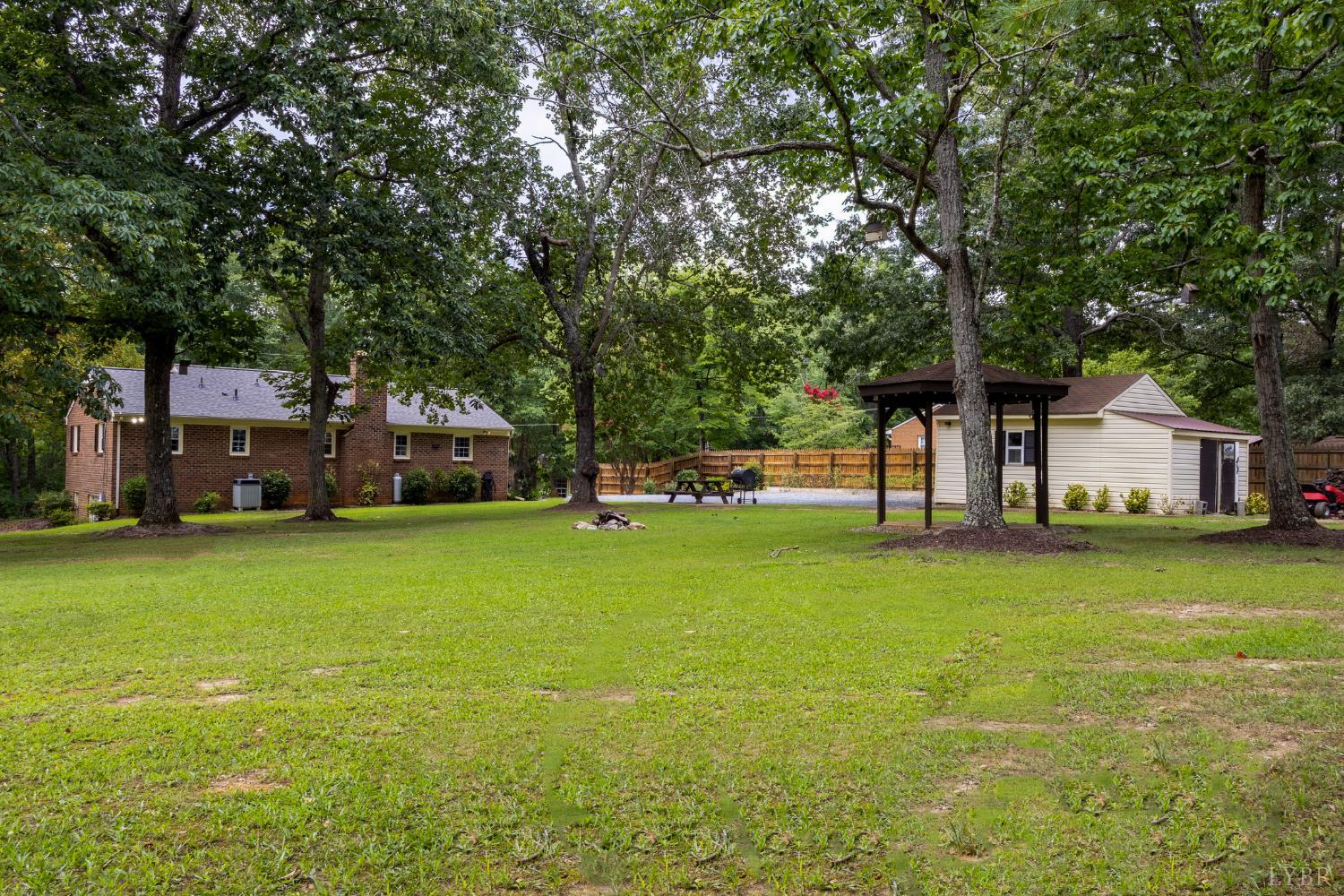 14611 Leesville Road Evington, VA 24550 - Photo 21 of 30 a yellow house in middle of the forest