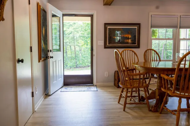a view of a livingroom with furniture window and wooden floor