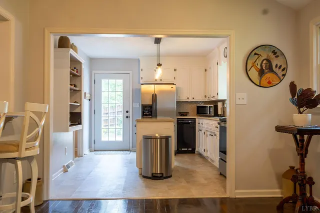 a kitchen with a refrigerator and a sink