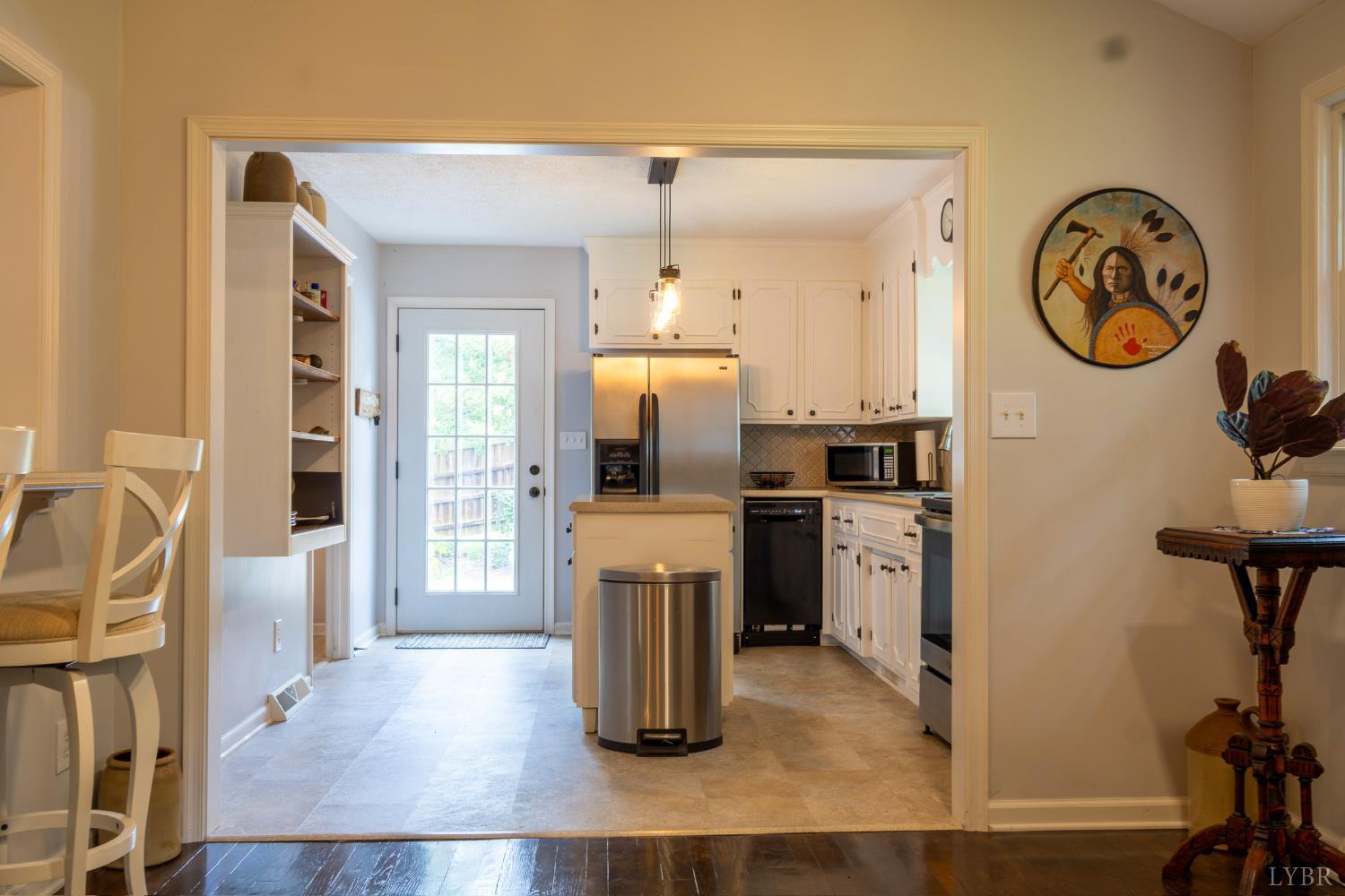 14611 Leesville Road Evington, VA 24550 - Photo 9 of 30 a kitchen with a refrigerator and a sink
