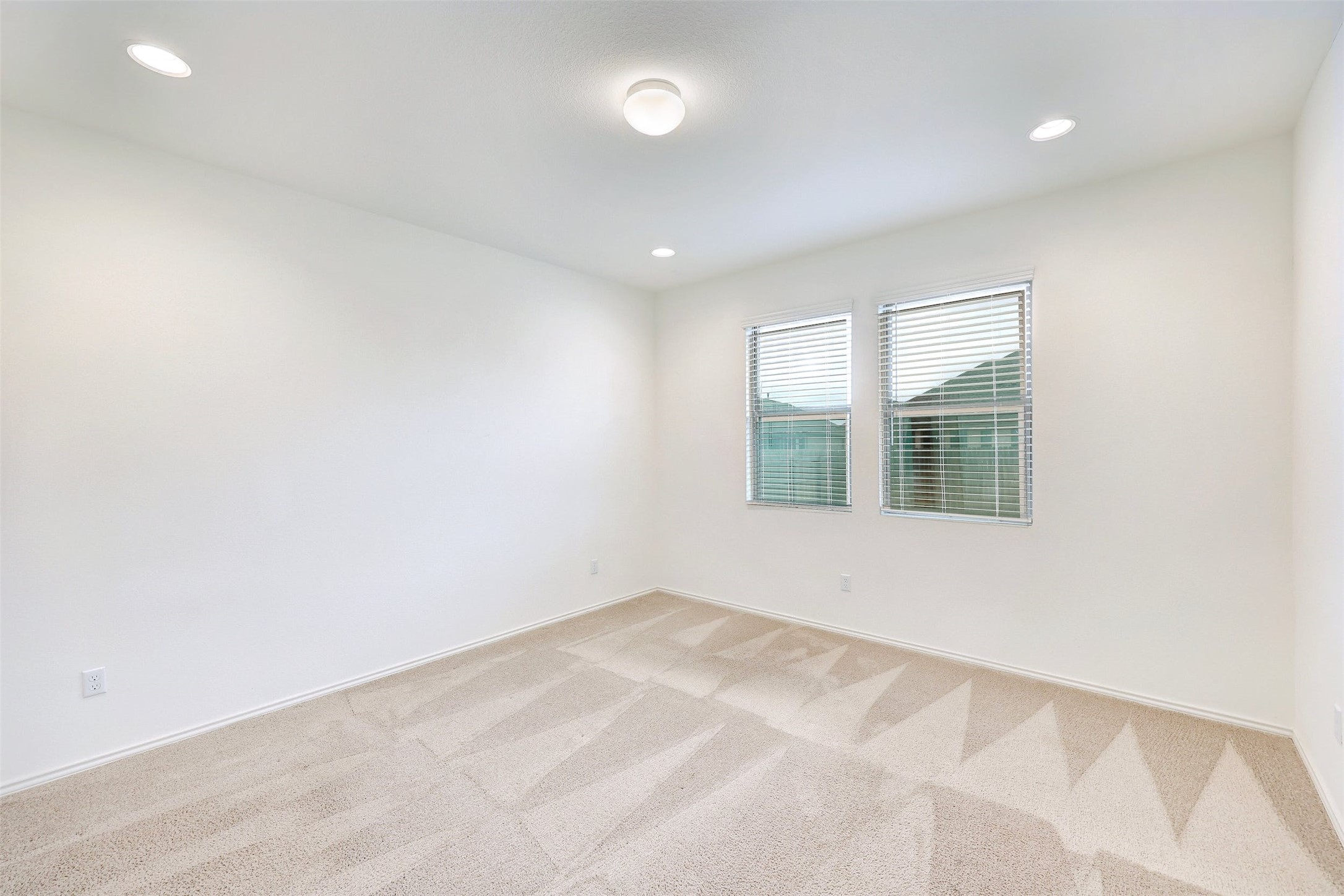307 Simmental Loop Hutto, TX 78634 - Photo 16 of 34 A well-lit room offering a neutral canvas for your personal style, ready for imaginative decor.