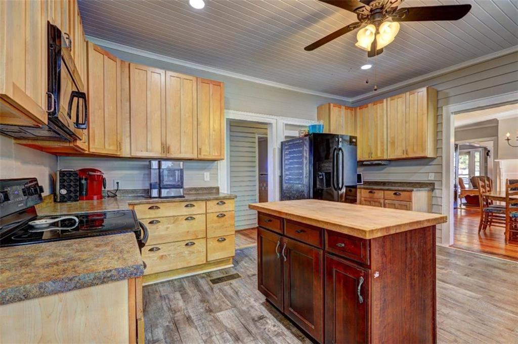 2870 Prospect Road Rutledge, GA 30663 - Photo 15 of 100 a kitchen with stainless steel appliances granite countertop a sink stove and refrigerator