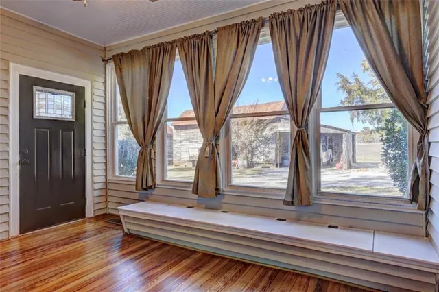 a spacious bedroom with a bed and a desk