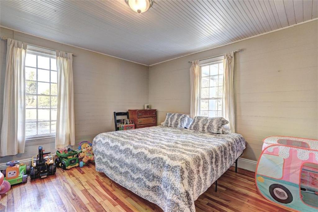 2870 Prospect Road Rutledge, GA 30663 - Photo 29 of 100 a bedroom with a bed and wooden floor