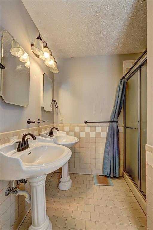 2870 Prospect Road Rutledge, GA 30663 - Photo 47 of 100 a bathroom with a sink and a mirror