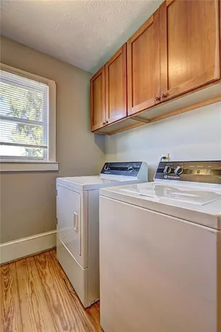 a front view of a house with a yard table and fire pit