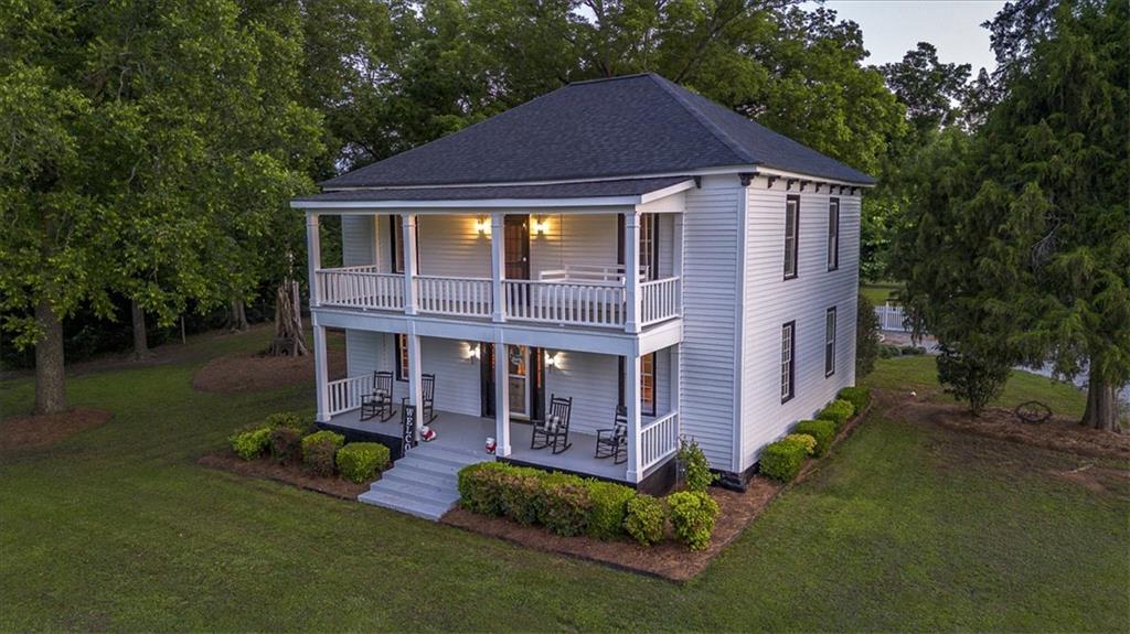 2870 Prospect Road Rutledge, GA 30663 - Photo 5 of 100 a front view of a house with a yard