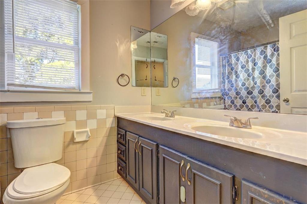 2870 Prospect Road Rutledge, GA 30663 - Photo 54 of 100 a bathroom with a granite countertop toilet sink and mirror