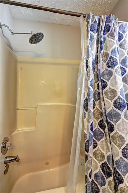 2870 Prospect Road Rutledge, GA 30663 - Photo 55 of 100 a bathroom with a bathtub and a shower