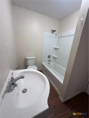 a bathroom with a bathtub and shower