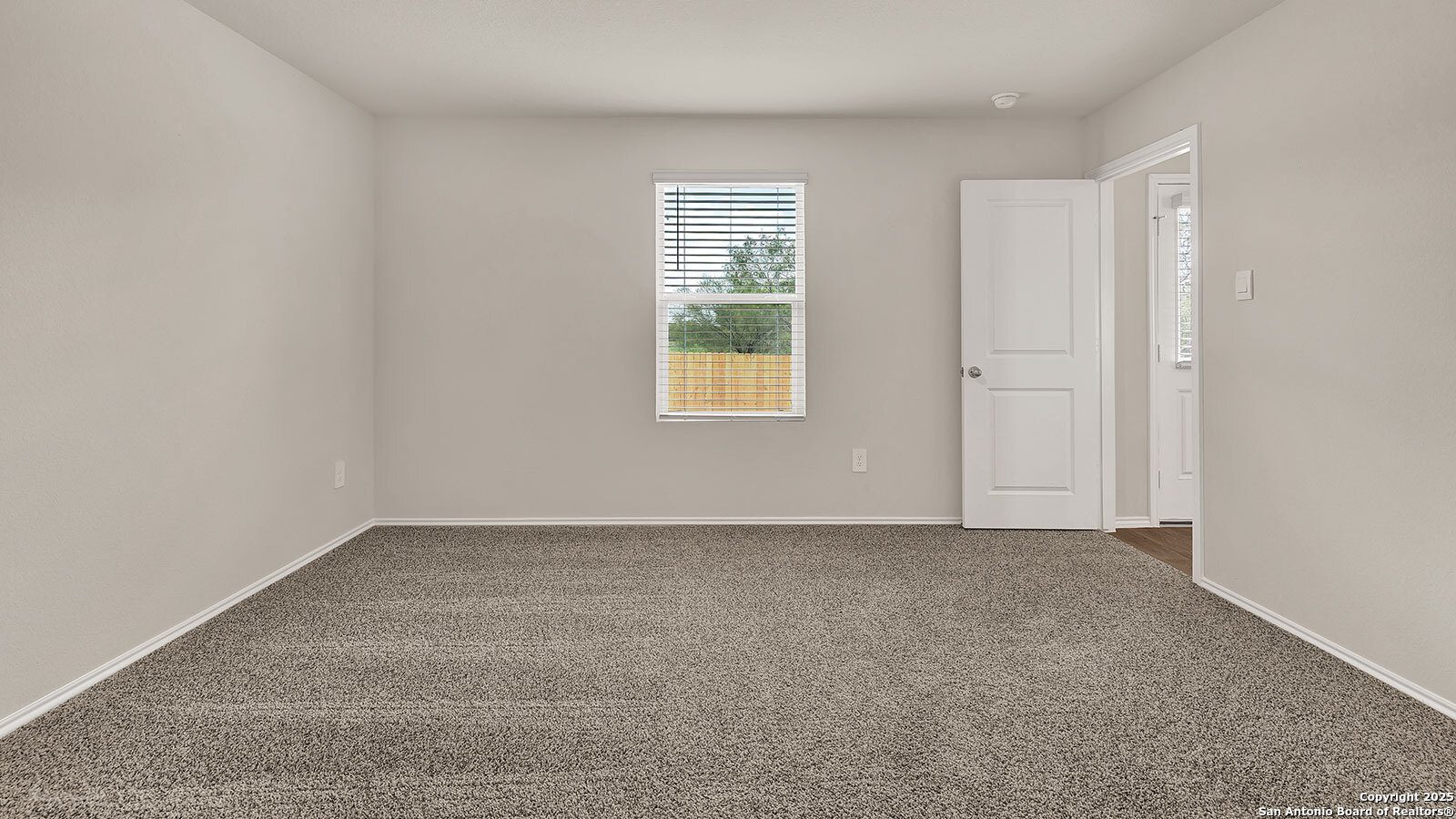400 Wild Goose Drive Luling, TX 78648 - Photo 16 of 28 an empty room with windows