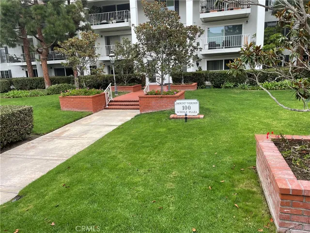 a view of a backyard with large trees