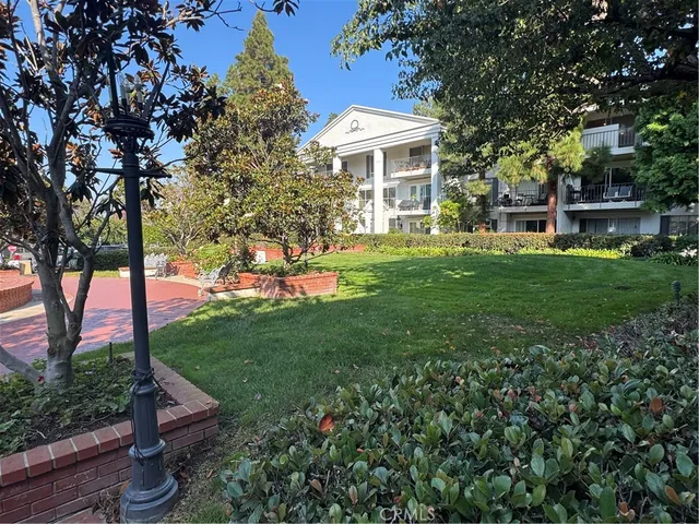a view of a balcony with chair and potted plants