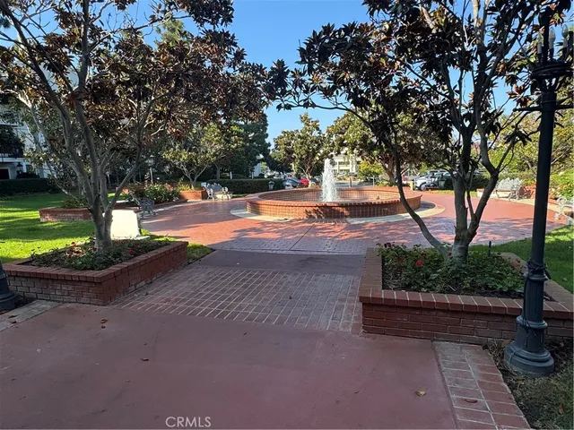 a view of a balcony with chair and potted plants