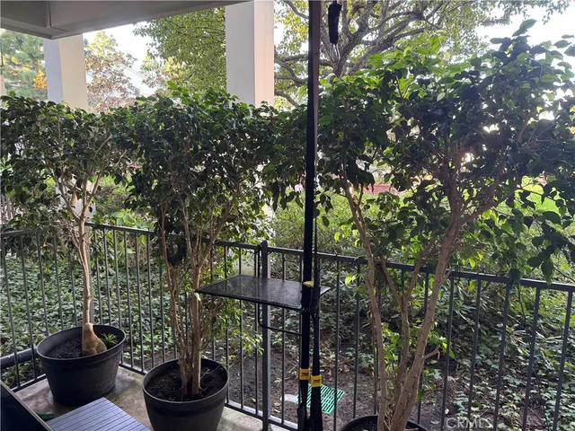 a kitchen with stainless steel appliances granite countertop a sink stove refrigerator and microwave