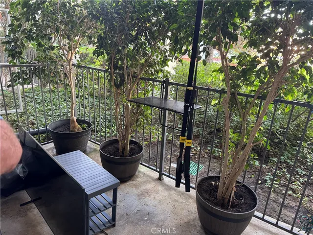 a kitchen with granite countertop a stove top oven microwave and sink