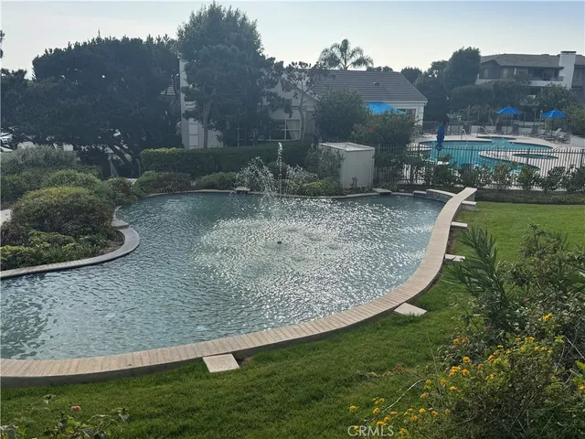 an aerial view of a house with swimming pool outdoor seating and yard
