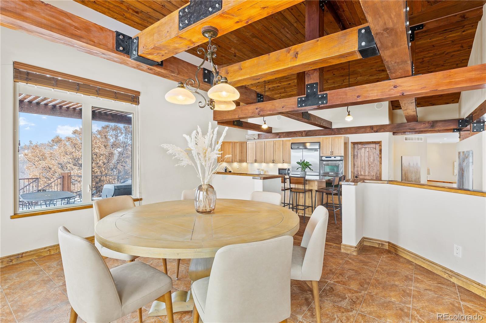2505 Big Bear Circle Sedalia, CO 80135 - Photo 12 of 50 a view of a dining room with furniture window and outside view