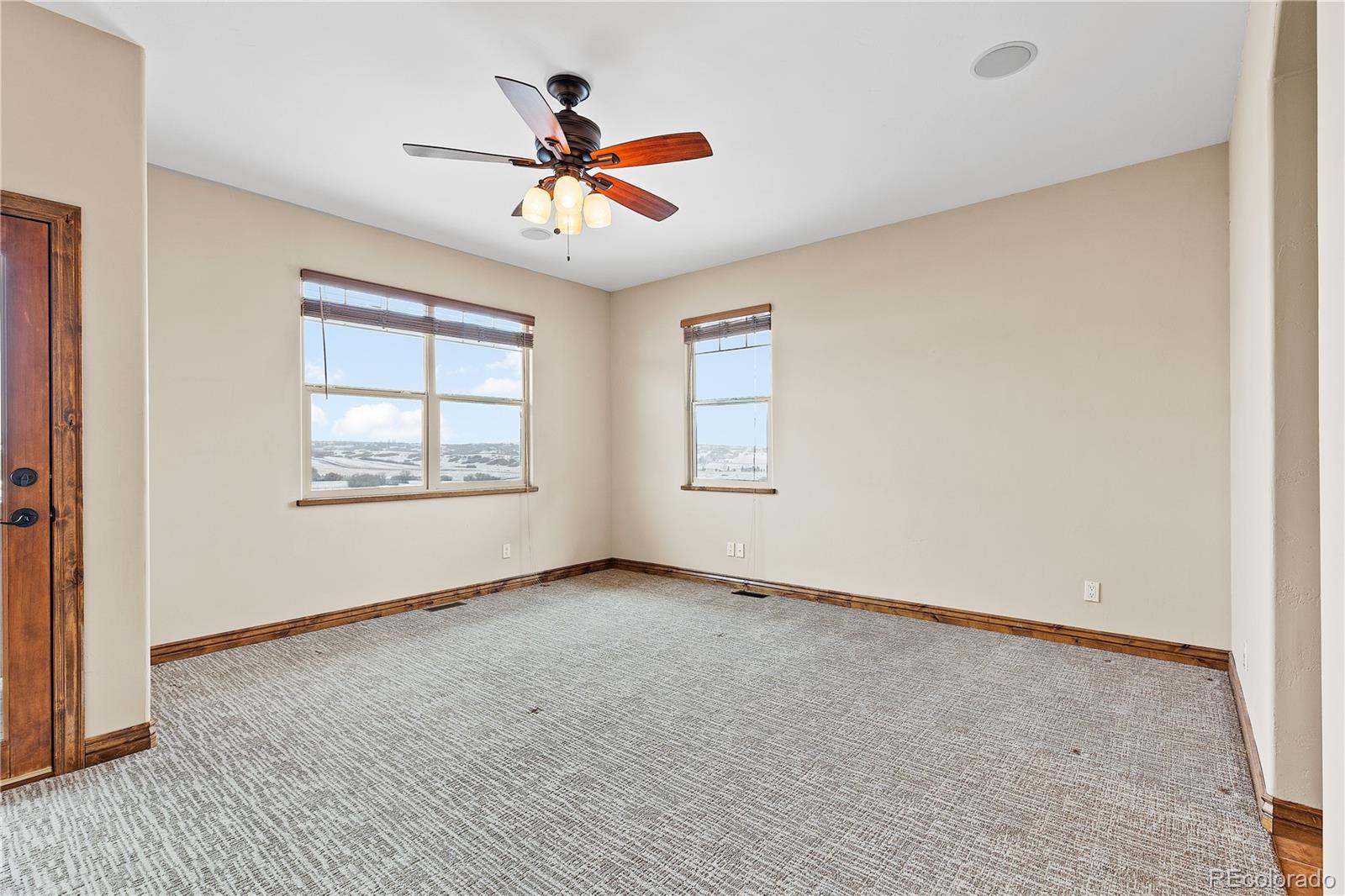2505 Big Bear Circle Sedalia, CO 80135 - Photo 24 of 50 wooden floor in an empty room with a window