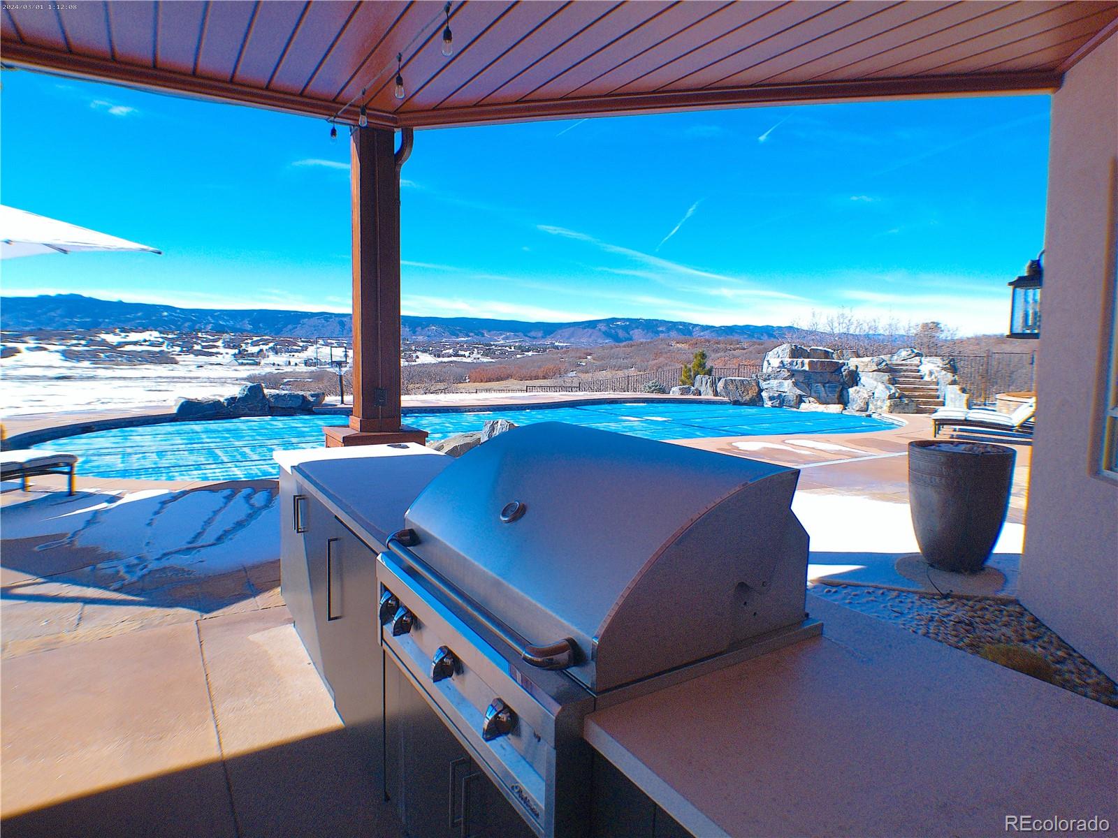 2505 Big Bear Circle Sedalia, CO 80135 - Photo 41 of 50 a room with wooden floor table and chairs