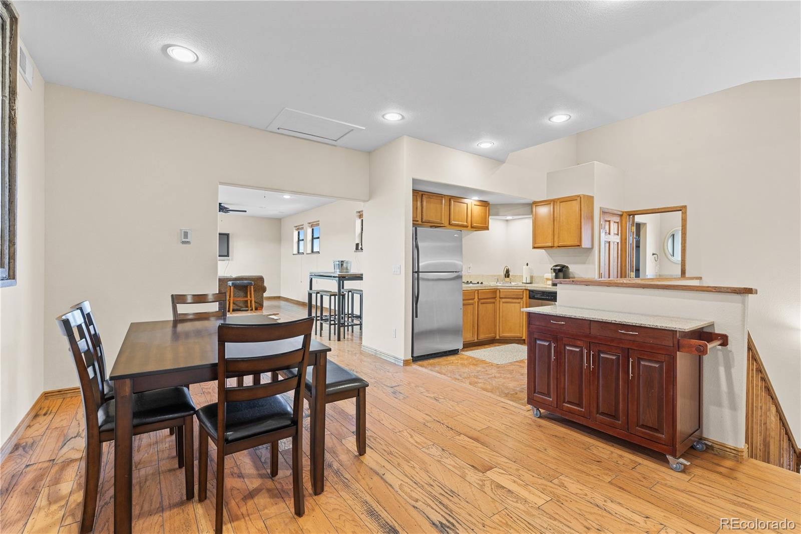 2505 Big Bear Circle Sedalia, CO 80135 - Photo 48 of 50 a view of a dining room with furniture and wooden floor
