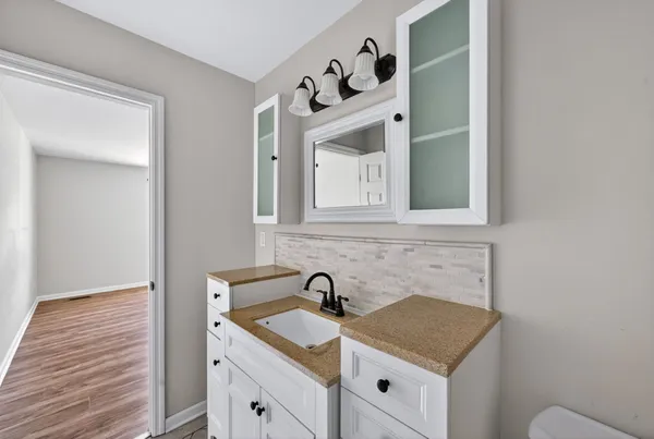 a view of a sink and a mirror