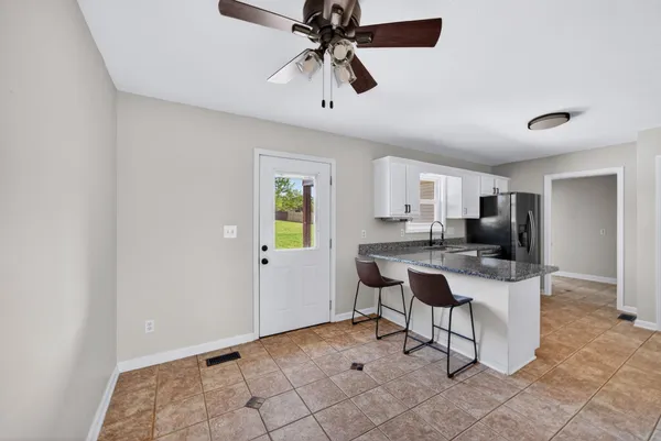 a view of a workspace with furniture