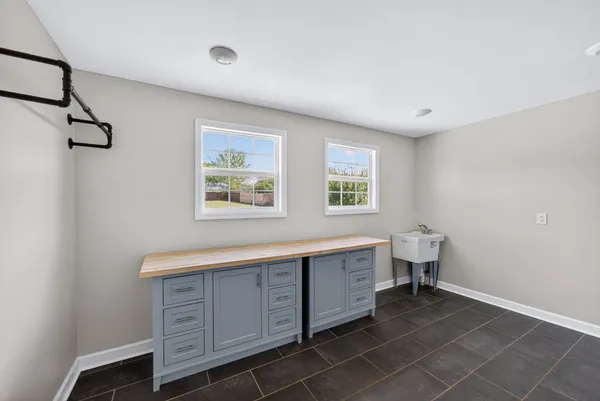 a spacious bathroom with a bathtub and a sink