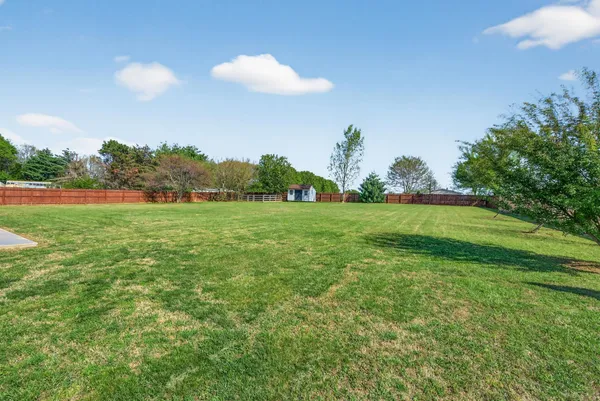a view of a golf course with a lake