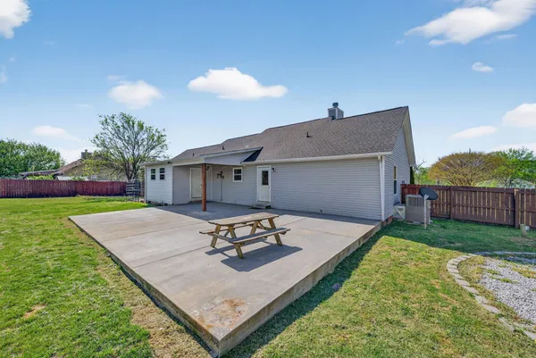a view of a backyard with a sitting area