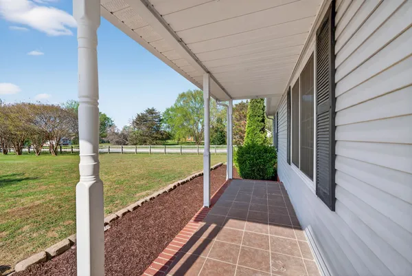 a view of balcony with yard