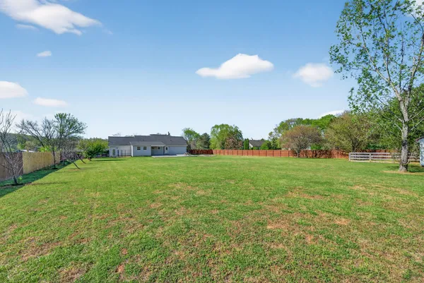 a view of building with outdoor space and trees