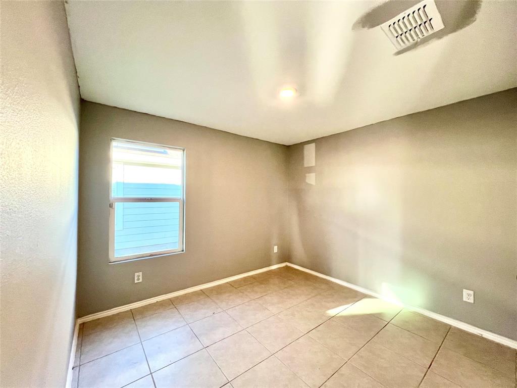 5711 Bristle Leaf Drive Princeton, TX 75407 - Photo 14 of 23 an empty room with a empty space and a window